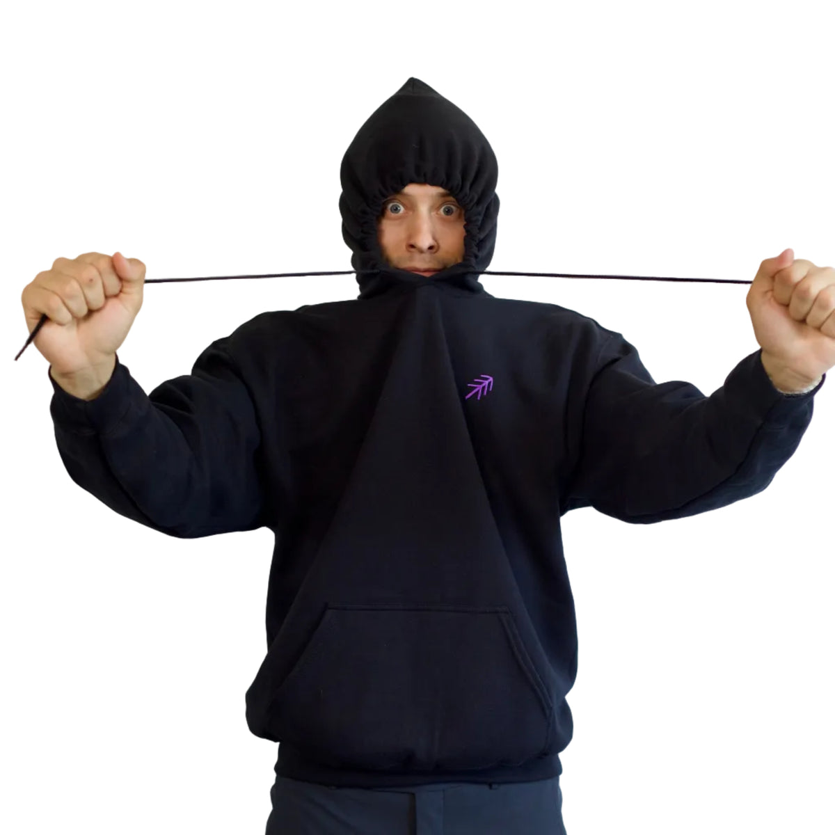 A person wearing a black hooded sweatshirt with a purple embroidered pass logo on the chest, holding the drawstring of the hood stretched across their face against a plain white background.