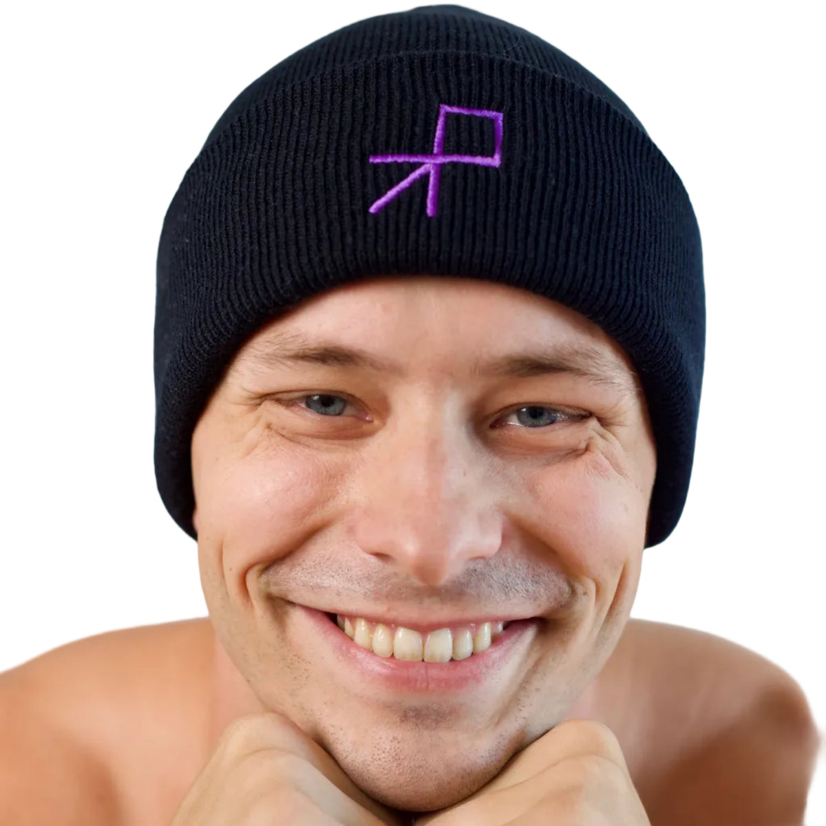 A close-up of a smiling dancer wearing a black knit beanie with a purple embroidered geometric push logo on the front, set against a plain white background.