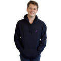 A smiling dancer wearing a black hoodie with a small purple stylized push logo on the left chest, set against a plain white background.