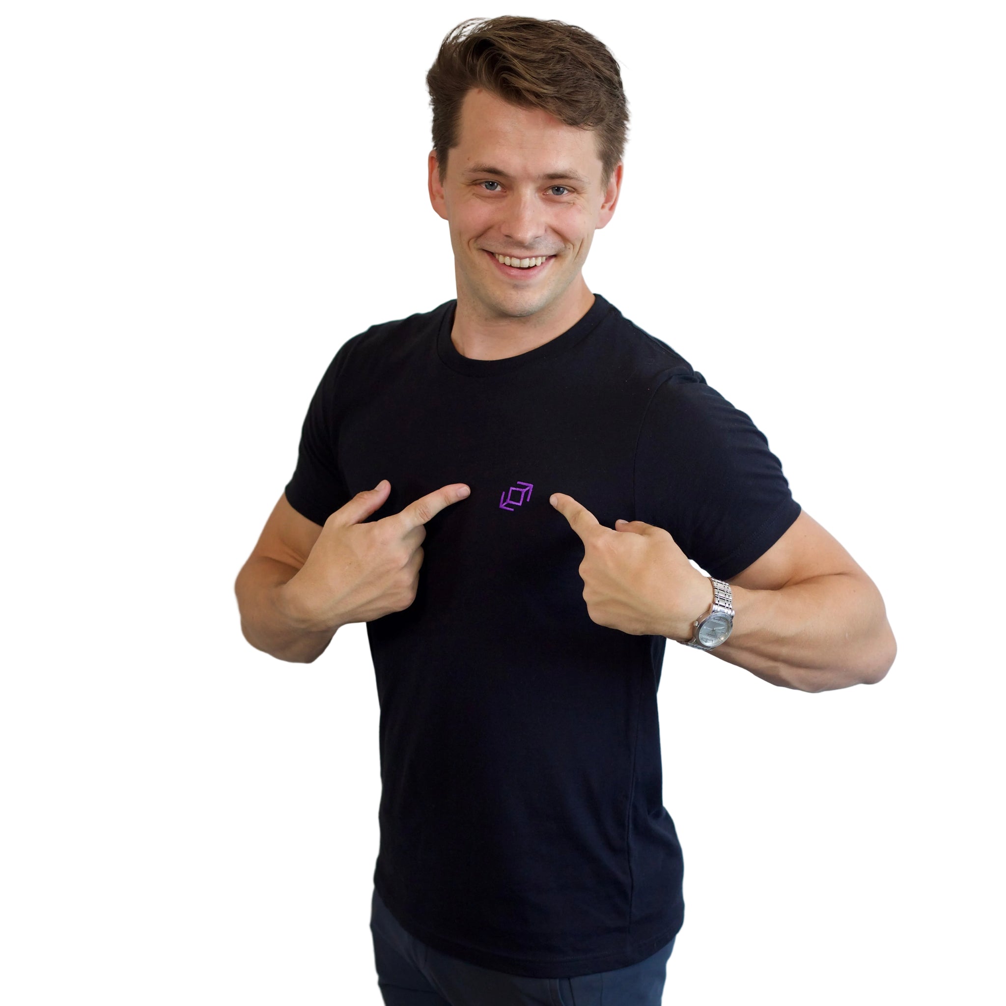 A standing dancer pointing to the logo on a black PPW Push tee showing the embroidered whip icon at chest height